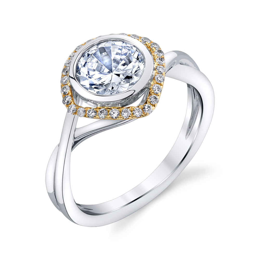 Contemporary designer diamond bezel set halo engagement ring by Parade Design.
